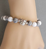 gray white bracelet