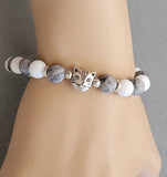 gray white bracelet